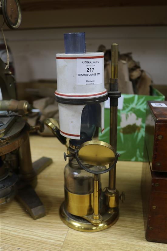 A Smith & Beck brass microscope, a bulls-eye condenser oil lamp, and a R & J Beck microscope microscope length 39cm